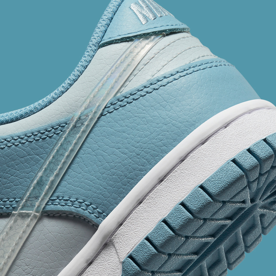 Nike Dunk Low
"Clear Blue Swoosh"