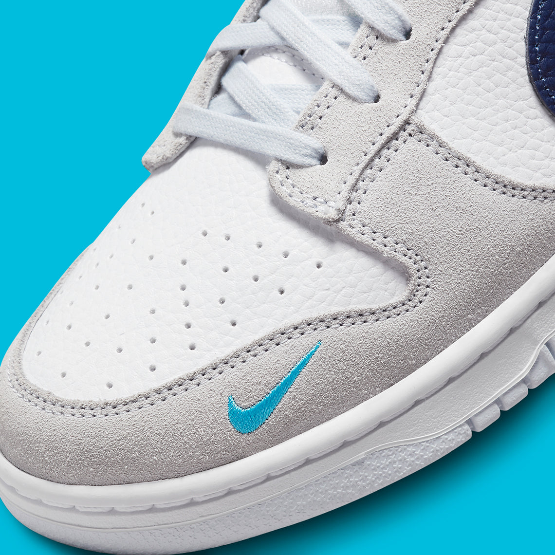 Nike Dunk Low
"White Grey Navy Aqua Mini Swoosh"