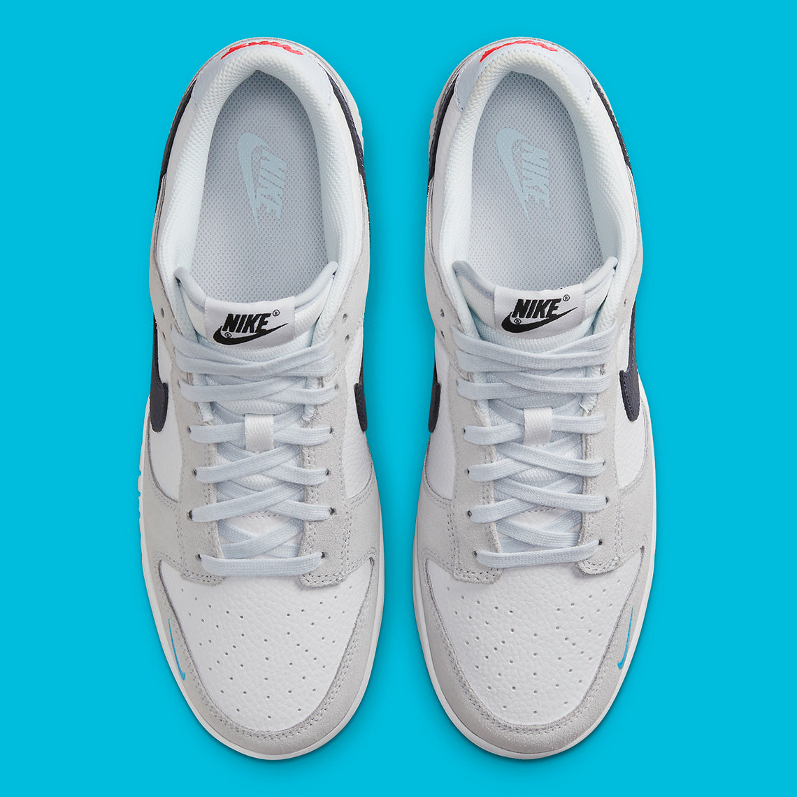 Nike Dunk Low
"White Grey Navy Aqua Mini Swoosh"